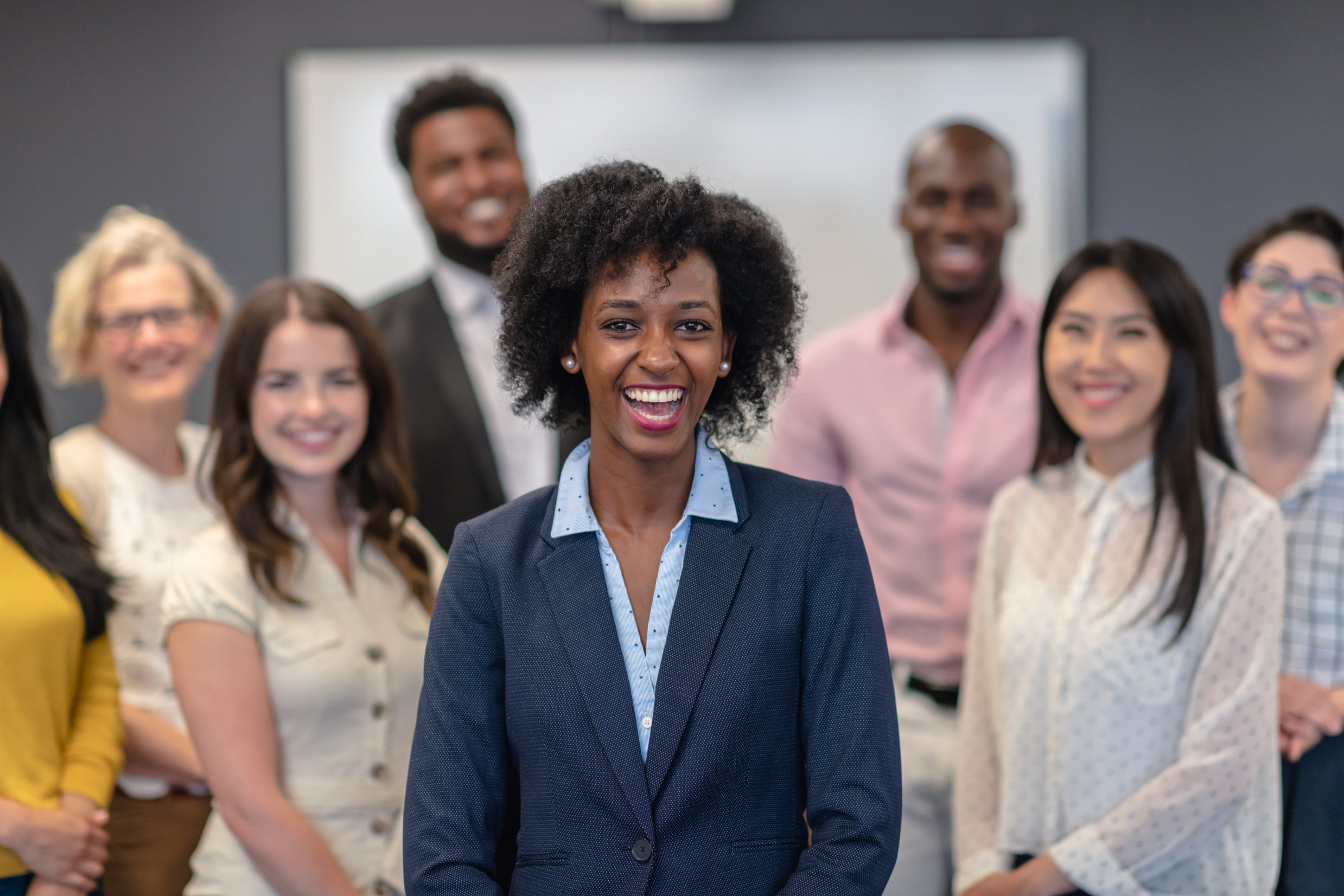 Female leader with diverse business team